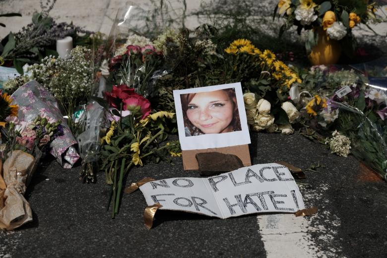 Flowers and a photo of car ramming victim Heather Heyer lie at a makeshift memoriall in Charlottesville