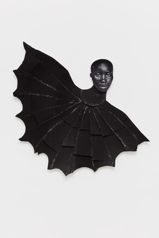 Batwoman, 2021. Collage with paper pins mounted. © Frida Orupabo.